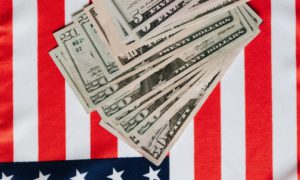 american dollars placed on national flag